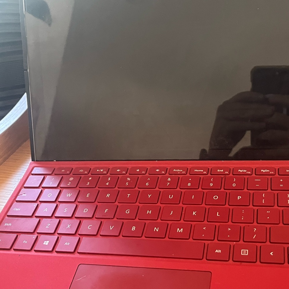 Microsoft Red Laptop with Black Display